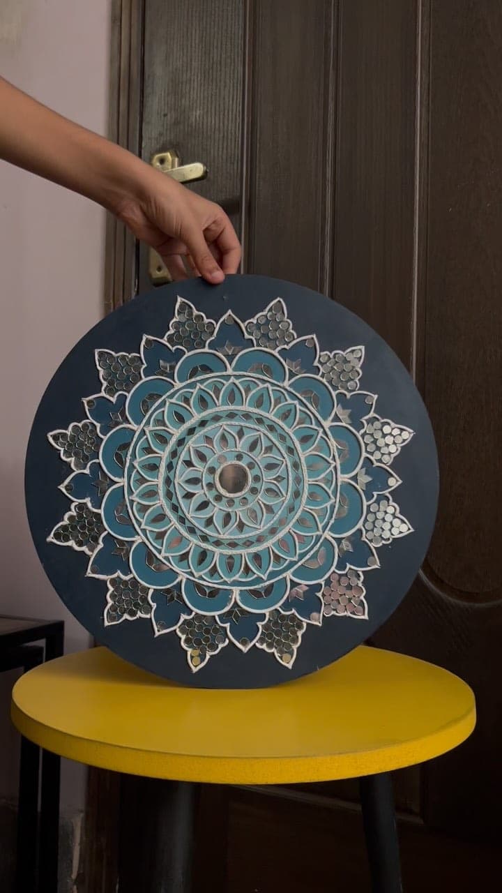 Navy and blue Lippan mandala with clay relief and inlaid mirrors