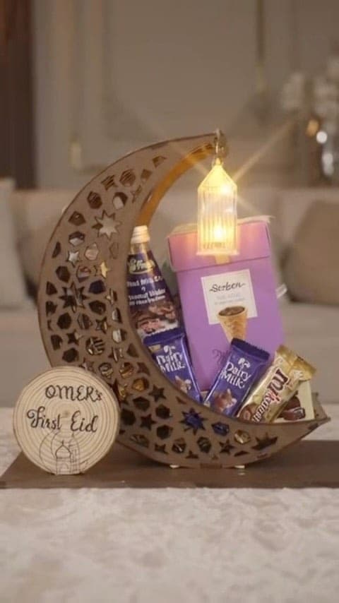 Crescent moon gift tray filled with chocolates and a personalised wooden tag